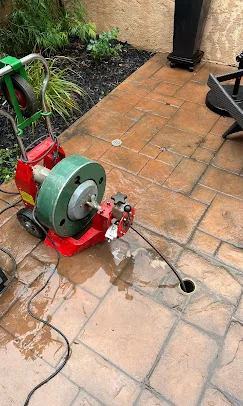 Bert's Mega Plumbing clearing a clogged drain in a San Fernando Valley home